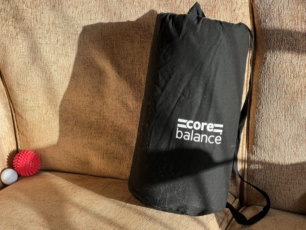 Core Balance acupressure mat rolled up in its carry bag